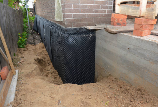 Happy homeowners after waterproofing job in Avon